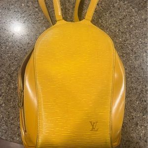Authentic Louis Vuitton backpack, mustard yellow with felt purple inside
